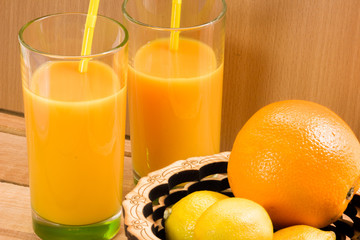 Orange juice in a glass with a straw. Nectar of fruit. Cocktail.
