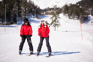 Happy friends having fun in Mountains ski resort - nature and sport picture.