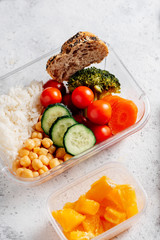 Healthy food in lunch box, on working table with working elements