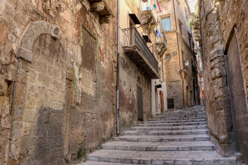 Postierla Via Nuova with its staircase, one of the main streets in the old town of Taranto, Puglia,...