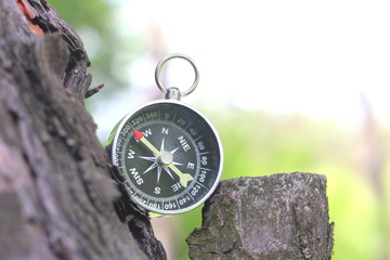 Old compass on natural background