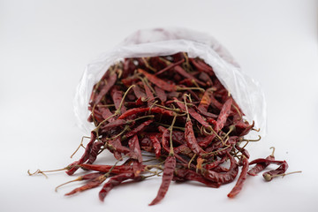 Dried red chili or chilli cayenne pepper isolated on white background cutout