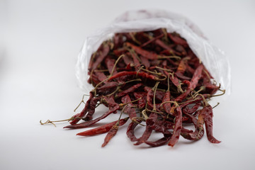 Dried red chili or chilli cayenne pepper isolated on white background cutout
