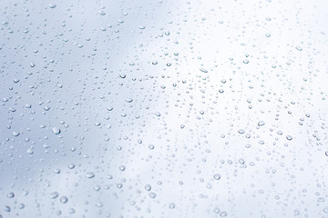 large raindrops on glass on an autumn day, inclement weather