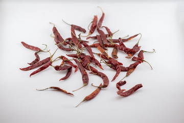 Dried red chili or chilli cayenne pepper isolated on white background cutout