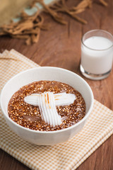 Thai dessert ,Tapioca pearl or Sago pudding with coconut meat in coconut milk on wooden table.