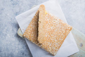 Slice of tempeh  or tempe made of fermentation process that binds soybeans, is traditional food from Indonesia and Malaysia