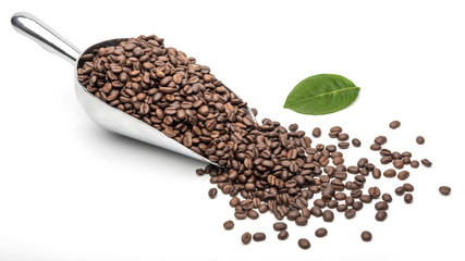 Spoon Coffee scoop and coffee beans roasted on a white background with copy space for your text