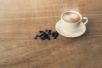 black coffee in a coffee cup top view isolated on wood background. with clipping path.