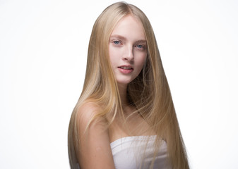 Naklejka premium Woman Smooth long blond hair natural make up healthy skin isolated on white