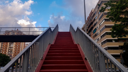 red exterior stairs of a walkway