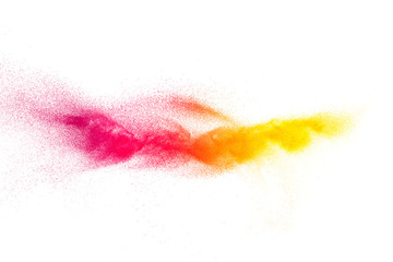 Multicolored particles explosion on white background. Colorful dust splatter.