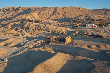 Fototapeta premium Aerial view over a village community on a desert mountain
