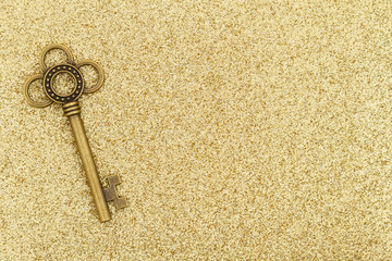 Skeleton keys on gold sparkle background