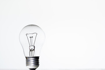 Light bulb frying on a white background isolate
