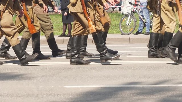 The soldiers in the form of military years marching in the parade on memorial Day. Close-up details of the legs of marching soldiers. Venue Russia Ufa boots close-up.