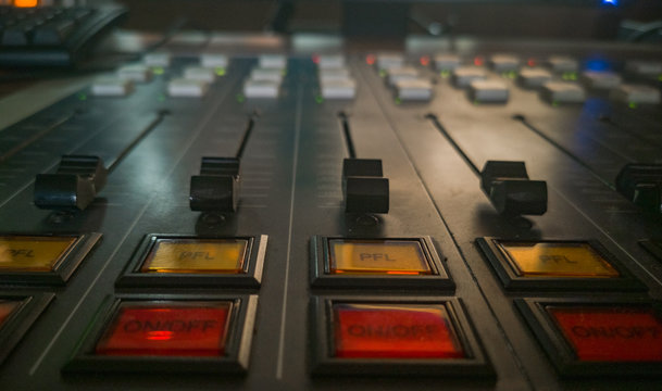 Front panel of music radio console in dark room