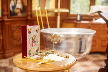 Churches. The baptism of a child. Rite of baptism. Icons in the temple.