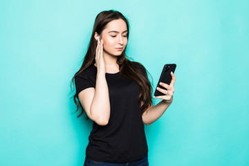 Funny young woman posing isolated on blue turquoise background studio portrait. People lifestyle concept. Mock up copy space. Listen music with air pods, keeping eyes closed