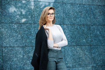 Confident business expert. Happy successful professional posing near office building. European girl. Russian business lady. Female business leader concept. Portrait Of Successful Business Woman