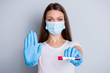 Photo of lady social distance avoid crowd contact hospital examination raise arm giving doctor blood probe covid test protect people wear protect face mask isolated grey color background