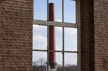 Industrial chimney through window