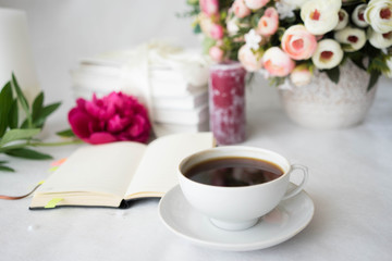 Peony bunch, cup of coffee, keyboard, notepad, wafers and pan, romance concept