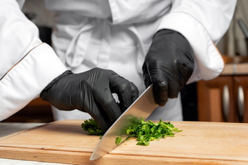 Parsley is cut on a wooden Board