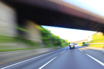 Speeding car on the highway, motion blur