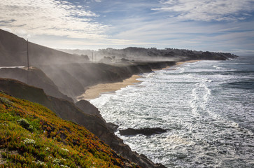 Morning fog over Montara State Beach. View of the Pacific Ocean, traveling south on the Pacific Coast Highway, California