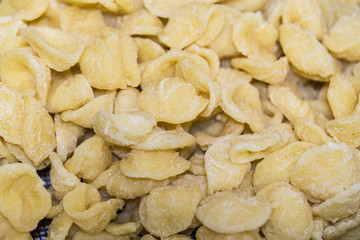 Typical Italian pasta orecchiette, raw, handmade