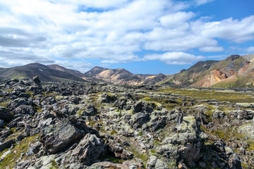 Landscape in Iceland. Green moss over the  volcanic mountains and lava fields in Landmannalaugar national park. Beautiful colored mountains and lava fields.Surreal nature scenery in highland.