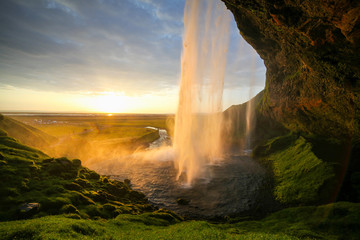 Waterfall Selandjafoss Iceland at sunset or sunrise. Beautiful waterfall in Iceland. Golden hour....