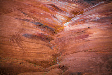 Geothermal region of Hverir in Iceland near Myvatn Lake, Iceland. Sulfur colored land and red...