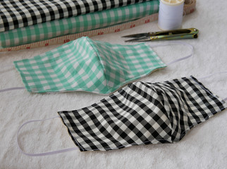 protective mask for protecting infection from a Covid-19 virus and other viruses.Health care concept,handmade face masks made of cotton.