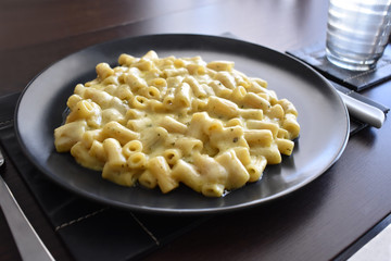 Homemade macaroni cheese with herbs.