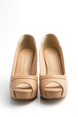 brown high-heel shoes white background