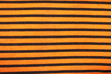 Orange striped fabric texture as background