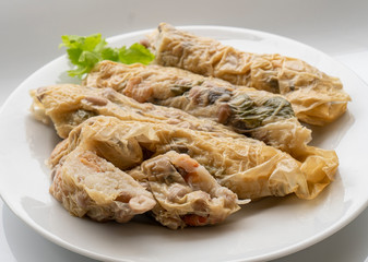 steam radish rolls, food made from Chinese radishes dried shrimp, shiitake mushroom and peanuts rolled with tofu sheets