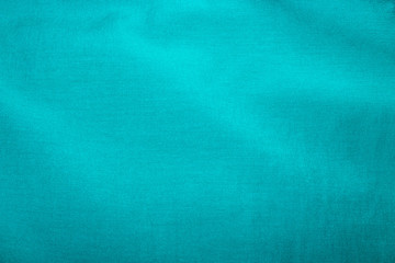 Crumpled blue fabric texture as background