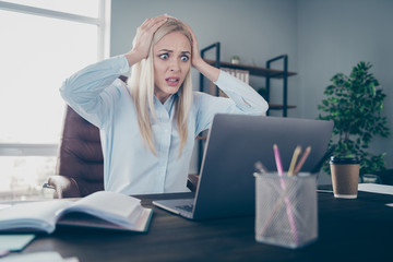 Photo of beautiful business lady look notebook table hands hold head screaming project epic fail lose big money wear shirt sitting chair modern interior office indoors