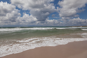Fototapeta na wymiar Seashore and clouds over the sea
