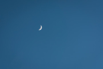 blue sky background with the moon