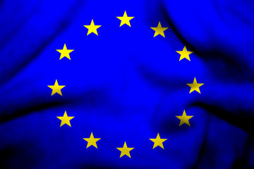 Flag of European Union on textile cloth background.