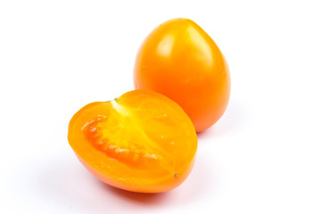 Yellow fresh tomatoes  isolated on white background in close-up