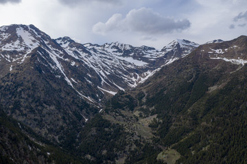 Aerial drone view of mountains in Andorra with snow on top