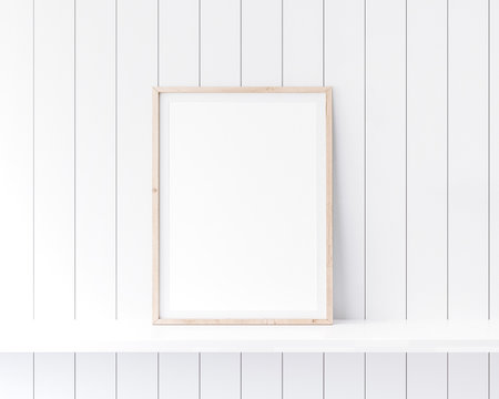 Mockup poster frame close up in coastal style interior on white shelf. 3D render	