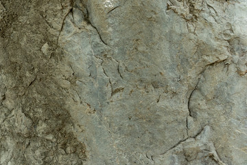 the texture of the cave or rocky cliffs are rugged with vignette background
