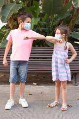 Children greeting each other during the coronavirus pandemic