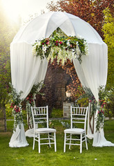 Wedding arch and two chairs